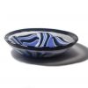 Large fused glass bowl in periwinkle blue, black, white, and aventurine blue